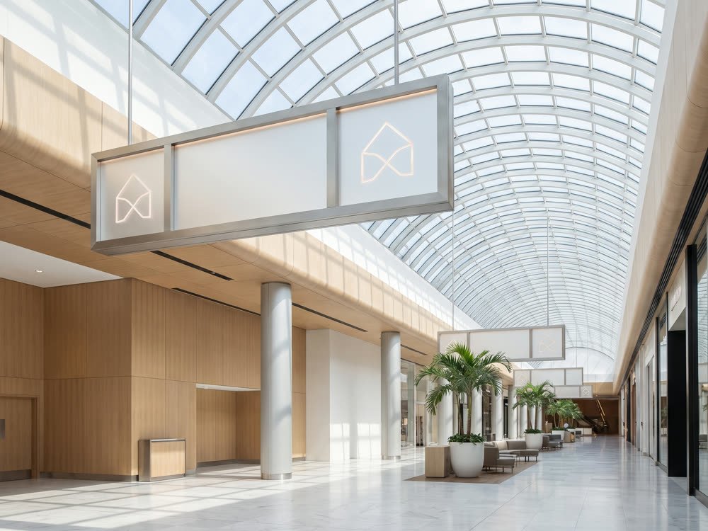 Suspended directional wayfinding signage